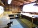 Spacious workshop with multiple workbenches and storage at 7419 E Abilene Ave, Mesa, AZ 85208