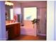 A large soaker tub sits beneath a bright window in this bathroom with a glass shower at 7712 S 25Th Ave, Phoenix, AZ 85041
