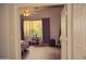 Bright bedroom with a ceiling fan, hardwood floors, modern decor, neutral walls, and natural sunlight from the window at 7712 S 25Th Ave, Phoenix, AZ 85041