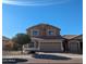 Charming two-story home featuring neutral tones and a well-maintained front yard at 7712 S 25Th Ave, Phoenix, AZ 85041