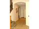 Entryway features tile flooring and access to upstairs with iron banister staircase at 7712 S 25Th Ave, Phoenix, AZ 85041