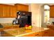 Stylish kitchen with granite countertops, a stainless steel fridge, and ample storage at 7712 S 25Th Ave, Phoenix, AZ 85041