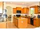 Spacious kitchen with granite countertops, island, and stainless steel appliances at 7712 S 25Th Ave, Phoenix, AZ 85041