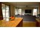Bright living room with plush sofa, large windows, and modern decor at 7712 S 25Th Ave, Phoenix, AZ 85041