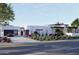 Modern home with clean lines, desert landscaping, and a two-car garage at 8226 E Davenport Dr, Scottsdale, AZ 85260