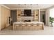 Modern kitchen with light wood cabinets, large island, and high-end appliances at 8226 E Davenport Dr, Scottsdale, AZ 85260
