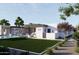 Relaxing backyard oasis with a sparkling pool, patio furniture, and lush grass at 8226 E Davenport Dr, Scottsdale, AZ 85260