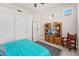 Comfortable bedroom with tiled floors, a ceiling fan, and a closet, along with charming wooden furnishings at 9523 E Sandy Vista Dr, Scottsdale, AZ 85262