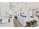 Bright, modern kitchen with a large island, stainless steel appliances, and pendant lighting at 9523 E Sandy Vista Dr, Scottsdale, AZ 85262