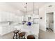 Bright kitchen featuring quartz countertops, stainless steel appliances, and white cabinetry at 9523 E Sandy Vista Dr, Scottsdale, AZ 85262