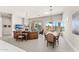 Spacious living room with fireplace, comfortable seating, and natural light with access to outdoors at 9523 E Sandy Vista Dr, Scottsdale, AZ 85262