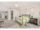 Spacious main bedroom with king bed, light colors, and access to ensuite bathroom at 9523 E Sandy Vista Dr, Scottsdale, AZ 85262