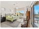 Bright main bedroom featuring a king bed, desert views, and private balcony access at 9523 E Sandy Vista Dr, Scottsdale, AZ 85262