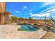 Inviting kidney-shaped pool with serene desert landscaping and ample seating area at 9523 E Sandy Vista Dr, Scottsdale, AZ 85262