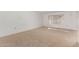 Spacious carpeted bedroom with large window at 9719 W Newport Dr, Sun City, AZ 85351