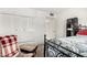 Bedroom with large closet and plush seating area at 9719 W Newport Dr, Sun City, AZ 85351