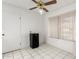 Room with ceiling fan, mini fridge, and window with blinds at 9719 W Newport Dr, Sun City, AZ 85351