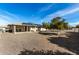 Rear view of the house showing the patio and solar panels at 9719 W Newport Dr, Sun City, AZ 85351