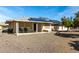 House exterior showcasing a patio and solar panels at 9719 W Newport Dr, Sun City, AZ 85351