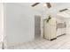 Kitchen with white cabinets, tile floor and view into dining area at 9719 W Newport Dr, Sun City, AZ 85351
