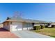 House exterior with a single car garage and neat landscaping at 10450 W Campana Dr, Sun City, AZ 85351
