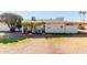 Backyard view of ranch home with patio at 10450 W Campana Dr, Sun City, AZ 85351