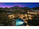 Stunning twilight aerial view of the estate with a backyard pool and mountain views at 10801 E Happy Valley Rd # 102, Scottsdale, AZ 85255