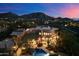 A luxury home at twilight with a stunning pool area, patio, and desert landscaping at 10801 E Happy Valley Rd # 102, Scottsdale, AZ 85255