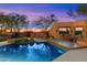 Relaxing backyard oasis featuring a pool, built-in seating, and desert landscaping at 10801 E Happy Valley Rd # 102, Scottsdale, AZ 85255