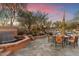 A backyard oasis features a pool, spa, dining area, and desert landscaping at 10801 E Happy Valley Rd # 102, Scottsdale, AZ 85255