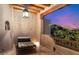 A peaceful balcony features tile flooring, a desert view, and a cushioned lounge chair at 10801 E Happy Valley Rd # 102, Scottsdale, AZ 85255