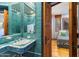 Unique bathroom featuring patterned tile, a built in sink, and adjacent bedroom space at 10801 E Happy Valley Rd # 102, Scottsdale, AZ 85255