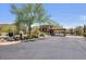 Gated community entrance with desert landscaping and scenic mountain views, offering privacy and natural beauty at 10801 E Happy Valley Rd # 102, Scottsdale, AZ 85255