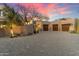 Beautiful desert home with a large brick driveway and desert landscaping at 10801 E Happy Valley Rd # 102, Scottsdale, AZ 85255