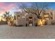 Stunning desert home with a large brick driveway and beautiful landscaping at 10801 E Happy Valley Rd # 102, Scottsdale, AZ 85255