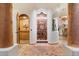 Elegant home entryway showcasing decorative woodwork and brick flooring at 10801 E Happy Valley Rd # 102, Scottsdale, AZ 85255