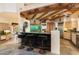 Beautiful kitchen features wooden beams, an island with bar seating, and stainless steel appliances at 10801 E Happy Valley Rd # 102, Scottsdale, AZ 85255