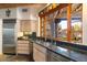 Bright kitchen features stainless steel appliances and a large window with desert views at 10801 E Happy Valley Rd # 102, Scottsdale, AZ 85255