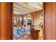 Cozy living room with coffered ceilings, a fireplace, tiled floors, and comfortable seating at 10801 E Happy Valley Rd # 102, Scottsdale, AZ 85255