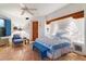 A cozy main bedroom features a blue and white color scheme with terracotta floors at 10801 E Happy Valley Rd # 102, Scottsdale, AZ 85255