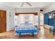 A bright main bedroom features a blue and white color scheme with terracotta floors at 10801 E Happy Valley Rd # 102, Scottsdale, AZ 85255