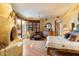 Warm bedroom with a fireplace, wood flooring, and ample natural light, creating a cozy retreat at 10801 E Happy Valley Rd # 102, Scottsdale, AZ 85255