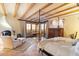 Spacious primary suite featuring a fireplace, exposed beam ceiling, and private balcony with scenic views at 10801 E Happy Valley Rd # 102, Scottsdale, AZ 85255