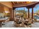 Outdoor dining area featuring a built-in grill and seating with desert landscaping views at 10801 E Happy Valley Rd # 102, Scottsdale, AZ 85255