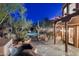 Charming outdoor patio with desert landscaping, a dining area, spa, and mountain views at 10801 E Happy Valley Rd # 102, Scottsdale, AZ 85255