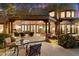 Outdoor patio perfect for entertaining, features comfortable seating, a fireplace, and desert landscaping at 10801 E Happy Valley Rd # 102, Scottsdale, AZ 85255