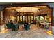 An outdoor patio is perfect for entertaining with a fireplace and dining space at 10801 E Happy Valley Rd # 102, Scottsdale, AZ 85255