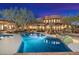 Inviting pool with beautiful desert landscape and home exterior in the background at 10801 E Happy Valley Rd # 102, Scottsdale, AZ 85255