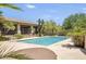 Beautiful community pool with lounge area and desert landscaping, perfect for relaxing and enjoying the outdoors at 10801 E Happy Valley Rd # 102, Scottsdale, AZ 85255