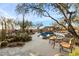Scenic pool area with desert landscaping, lounge seating, and a comfortable built-in seating area for outdoor relaxation at 10801 E Happy Valley Rd # 102, Scottsdale, AZ 85255